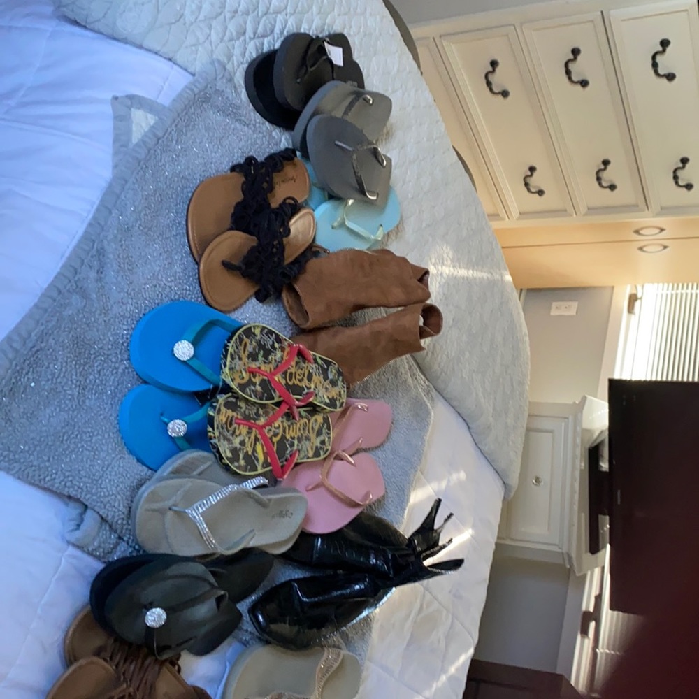 13 pairs of sandals and boots. Some with tags. Perfect condition.